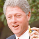 President Clinton displays one of the needles that will soon pump sweet relief into America's blighted inner cities.